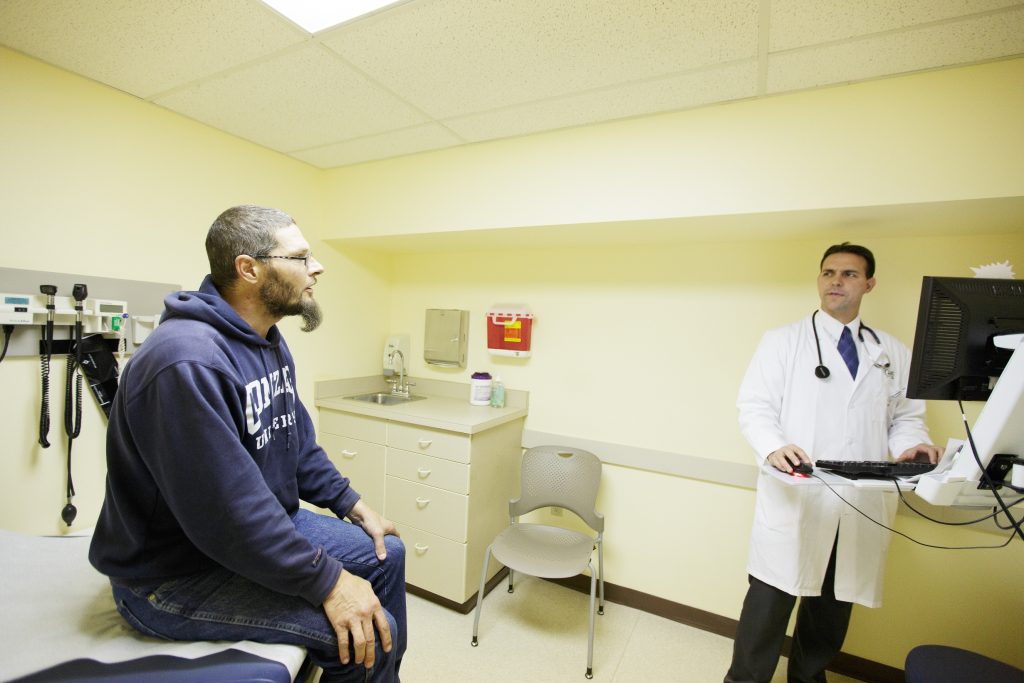 Male patient getting a health screening