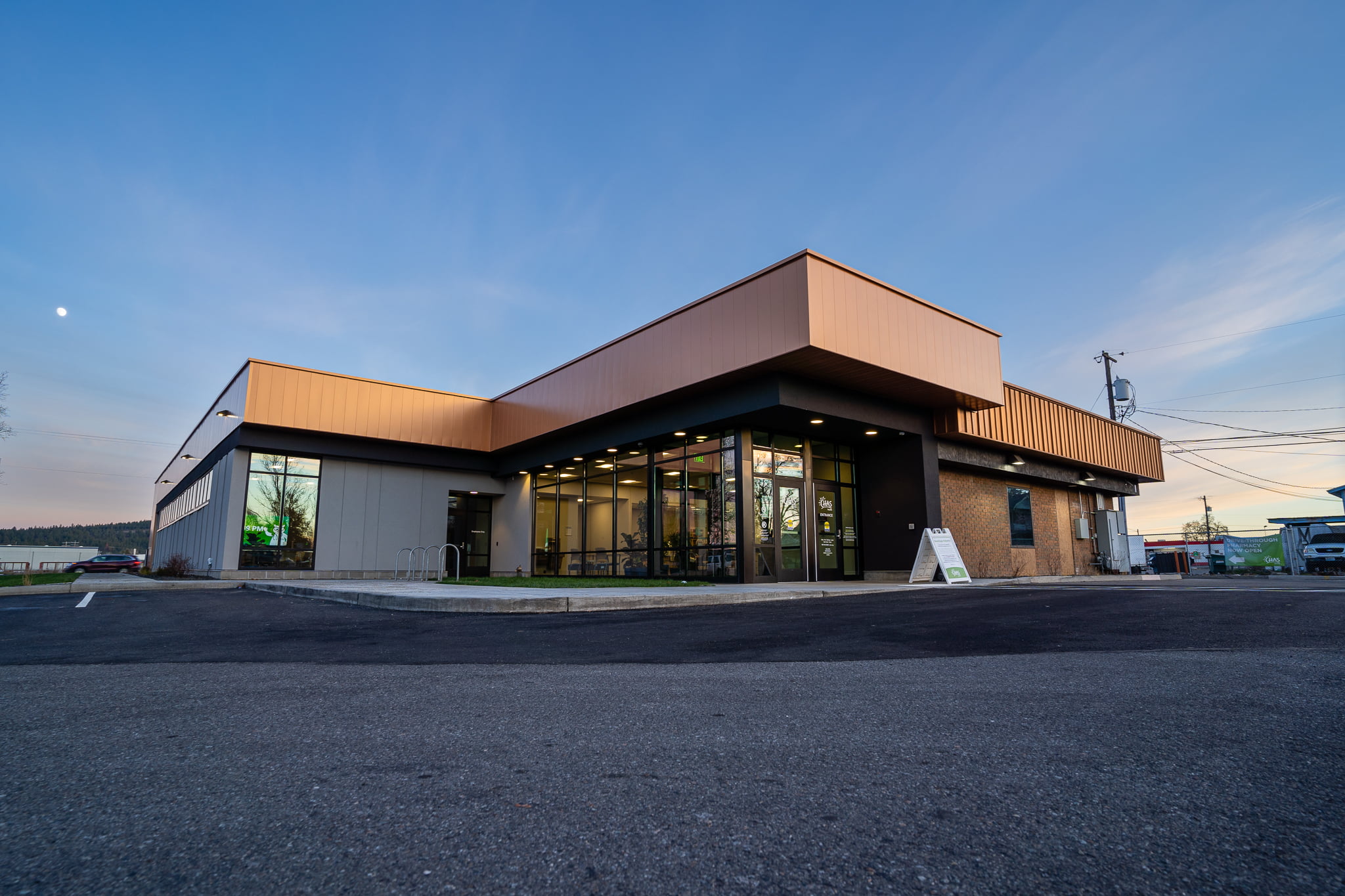 Exterior view of the CHAS Health Market Street Clinic building with a modern entrance and large windows.