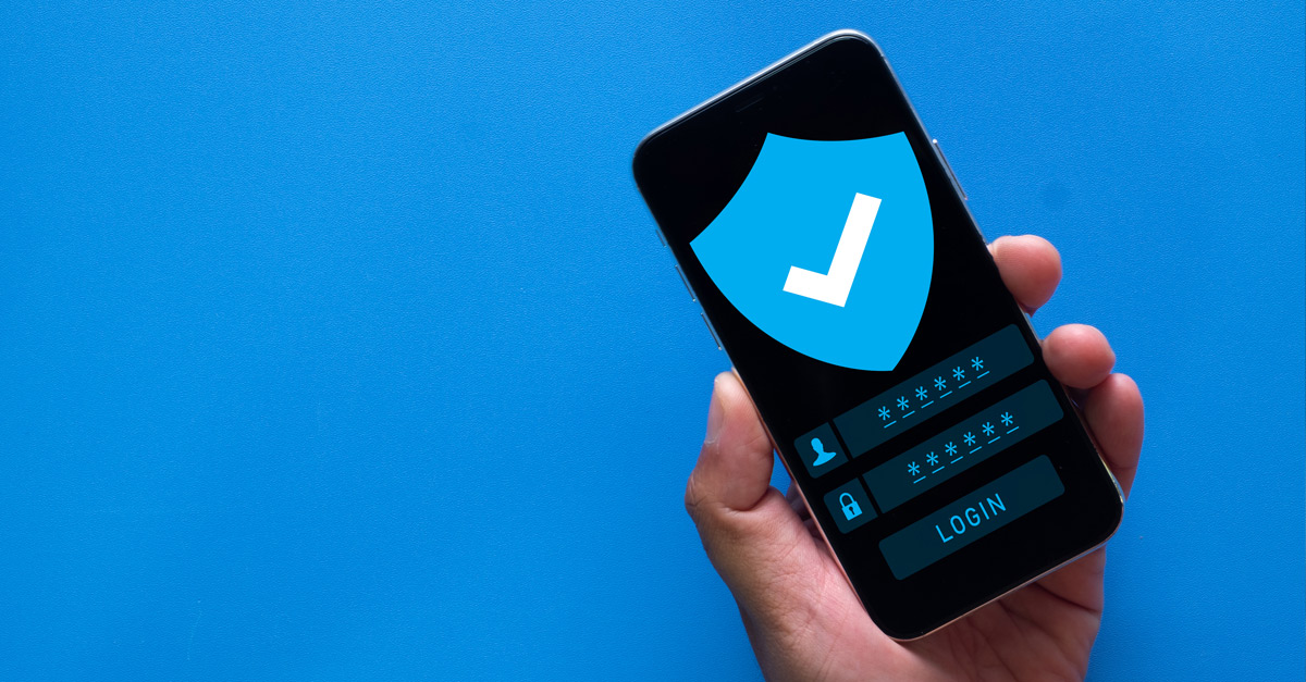 Image with a blue background showing a hand holding a cell phone with a secure login screen.