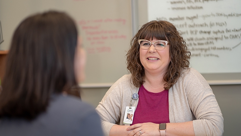 CHAS Health patient resource specialist talking to patient