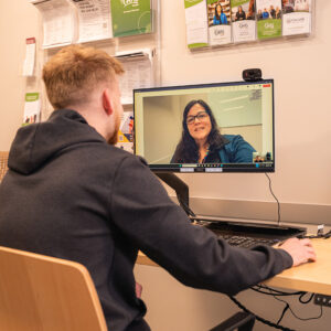 Man meeting with a provider using telehealth