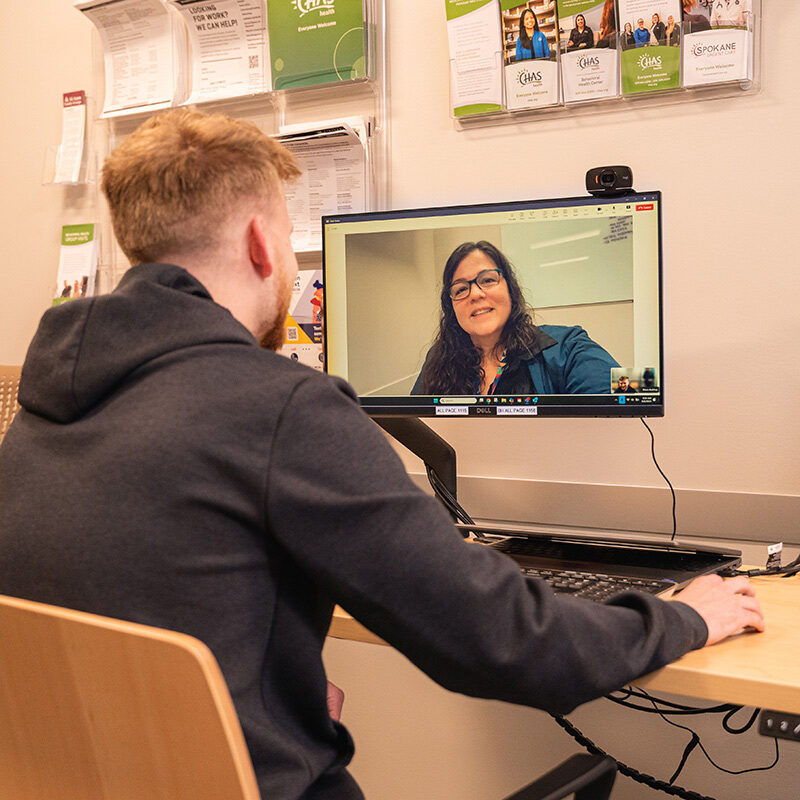 Man meeting with a provider using telehealth